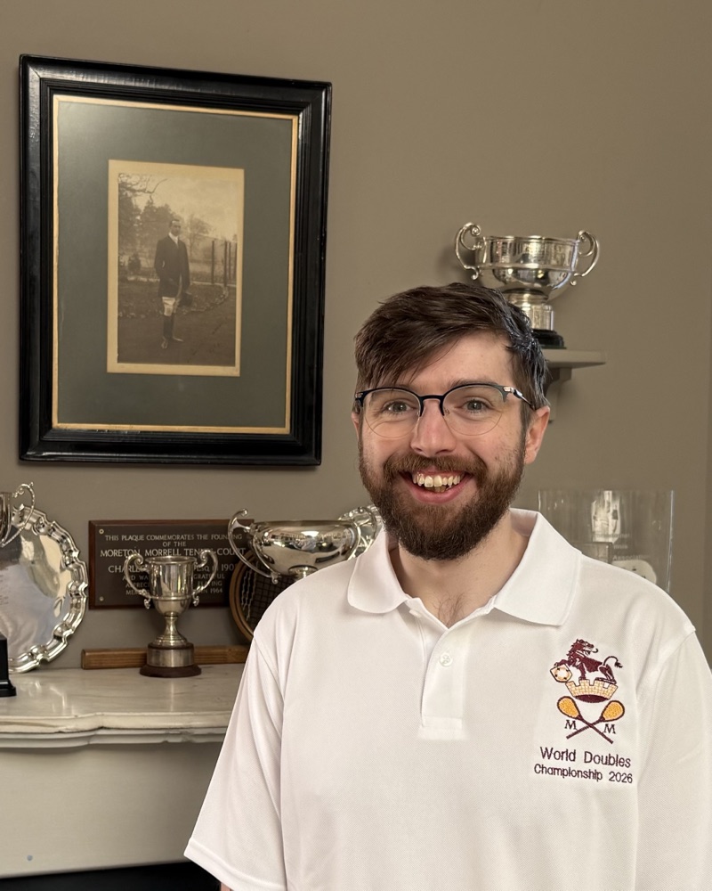 Chris Aley in the club room in front of the trophy cabinet