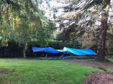 Test slabs on the lawn under blue covers